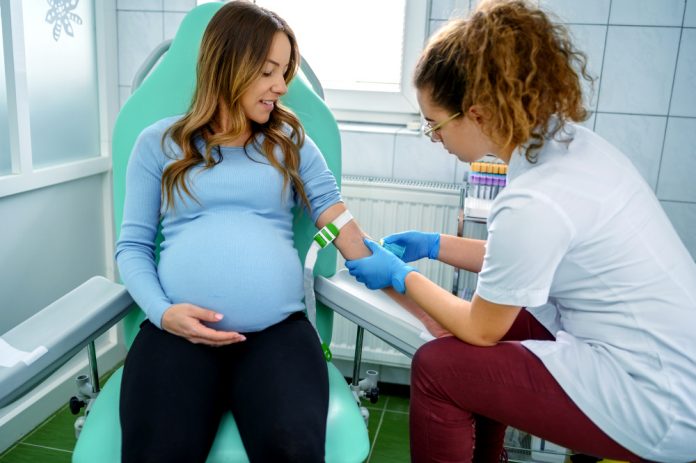 Pregnant woman having a blood test Pregnant Woman Having A Blood Test