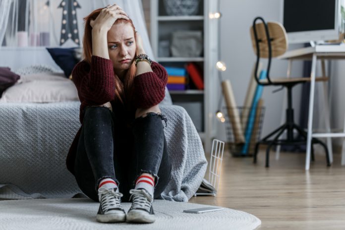 Worried Girl Holding Head