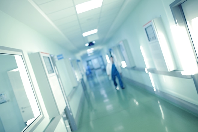 Doctor Hurries For Help Along The Long Hospital Corridor, Blur