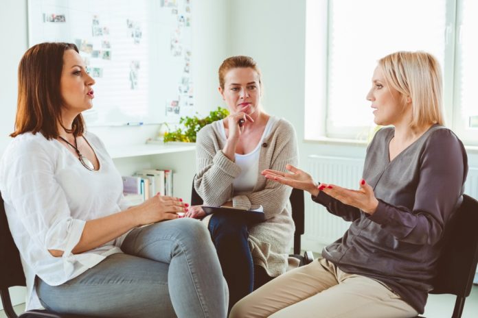 Professional Listening To Woman Sharing Problems