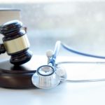 Gavel and stethoscope. medical jurisprudence. legal definition of medical malpractice. attorney. common errors doctors, nurses and hospitals make