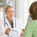 Attractive young caring doctor