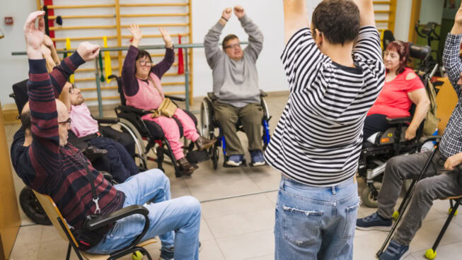 People with disability exercising during group physiotherapy session