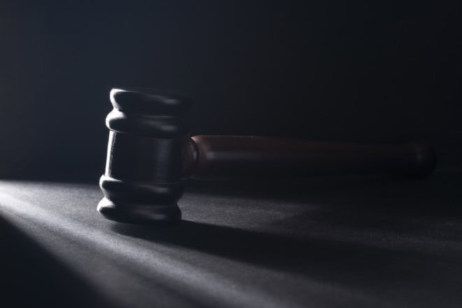 Gavel on the black table